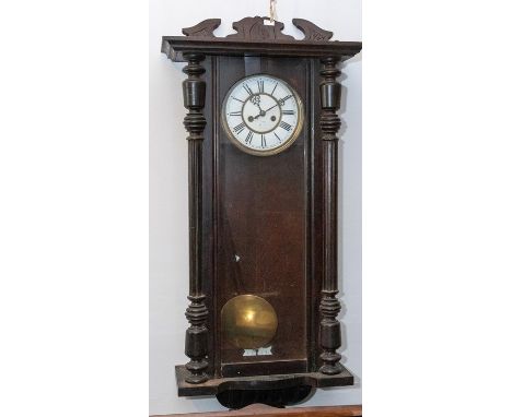 Vienna wall clock Late Victorian two train movement chiming on a gong. Contained in a Imitation rose wood case 7” enamel dial