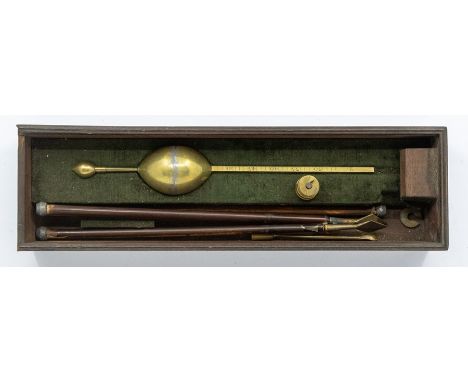 Brass late Victorian hydrometer with weights and assorted tools in mahogany box.