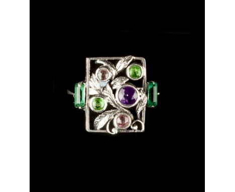 Manner of Bernard Instone Panel ring the openwork rectangular panel with collet set vari-coloured gemstones and pastes framed