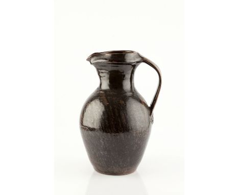 Trevor Corser (1938-2015) at Leach Pottery Jug tenmoku glaze impressed potter's and pottery seals 30.5cm high.