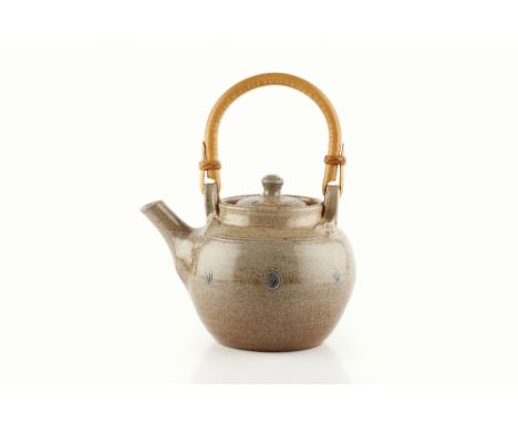 Ray Finch (1914-2012) at Winchcombe Pottery Teapot swirl decoration, cane handle impressed potter's seal 18cm across.