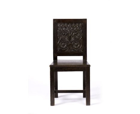 Manner of Mackay Hugh Baillie Scott (1865-1945) Arts & Crafts chair oak, the back panel carved with flowering tree 94cm high.