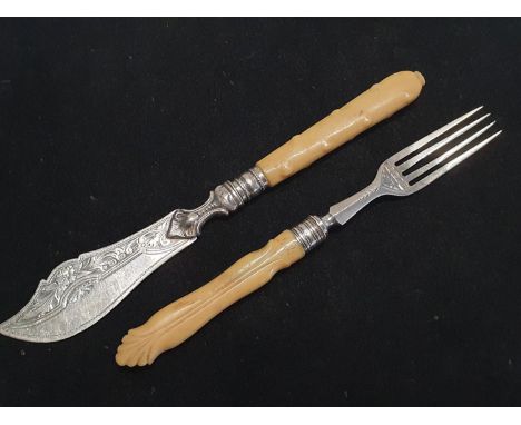 A hallmarked set of silver bladed knife and fork combo 