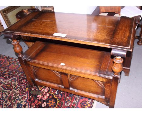 A monk's oak bench with carved back panel, on square stile supports, 42" wide