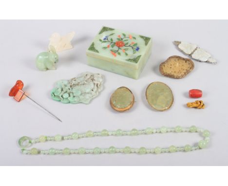 A Chinese green jade trinket box, lid mounted hardstone decoration of a spider in flora, a carved jade bead necklace, a jade 