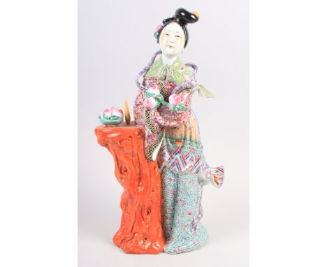 A Chinese Republic period Quan Yin figure with polychrome enamel decoration, impressed seal marks to base, 15 3/4" high (dama