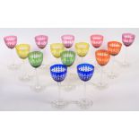 Fourteen overlaid and cut glass hocks, in various colours