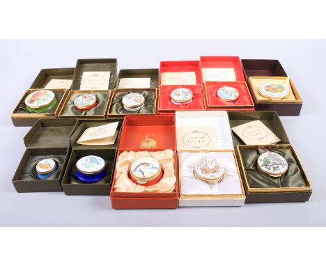 Eleven pill boxes, including English enamels by Crummles, mostly decorated with birds, in boxes