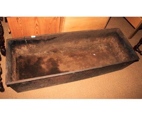 A cast iron rectangular trough with ring handles, 50" long (cracked)&nbsp;