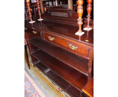 A Victorian mahogany bookcase with raised back, fitted two short drawers over two shelves, on bracket supports, 54" wide