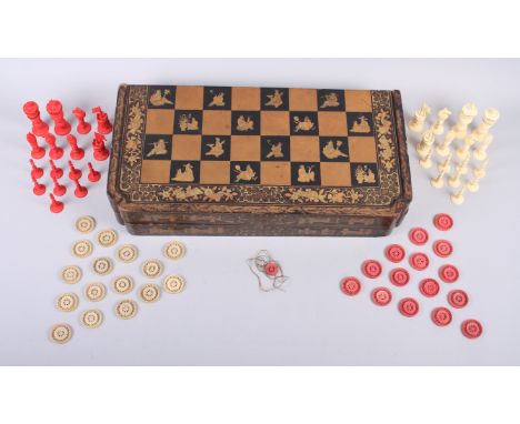 A Chinese ivory chess set, a set of ivory backgammon pieces and a Chinese black and gilt lacquered folding chess/backgammon b