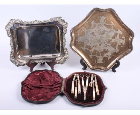 A silver ferruled nutcracker set, in fitted case, and two silver plated trays
