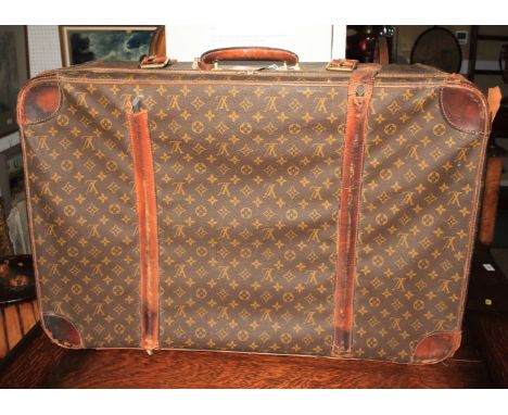 A vintage Louis Vuitton monogram pattern leather suitcase, 31" x 20"
