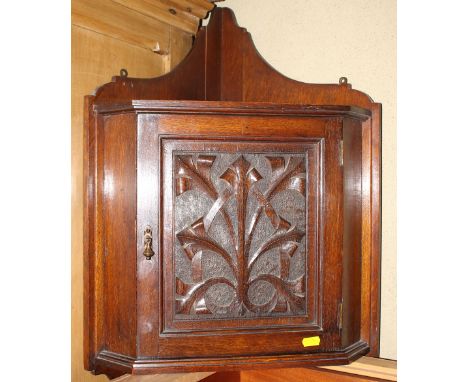 An oak wall hanging corner cupboard enclosed carved panel door, 18" wide, a mahogany and inlaid gallery tray and a print of h