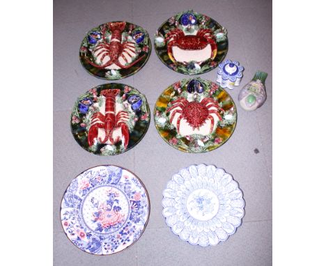 Four Palissy style pottery dishes, decorated crustaceans, a Delft charger, a similar inkwell, a Japanese Imari style charger,