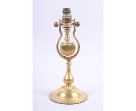A train's brass gimbal lamp, now converted to electricity