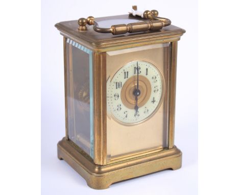 A brass cased, five-window carriage clock with white enamel dial and Arabic numerals, 4 1/4" high