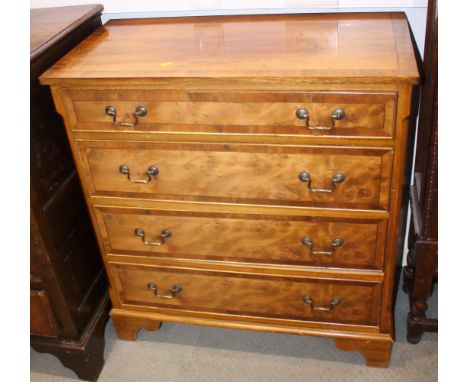 A yew and banded chest of four long drawers, on bracket feet, 34" wide