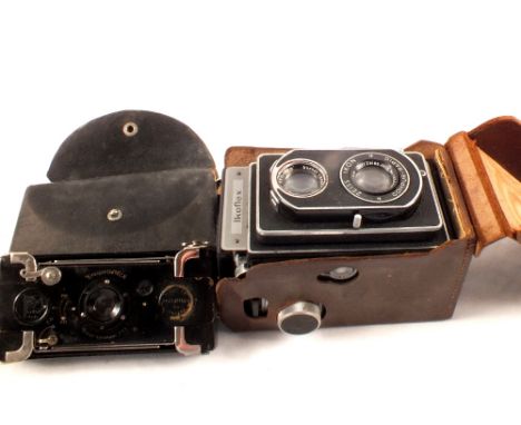 A Zeiss Ikon Ikoflex Reflex camera and Ensignette No.2K