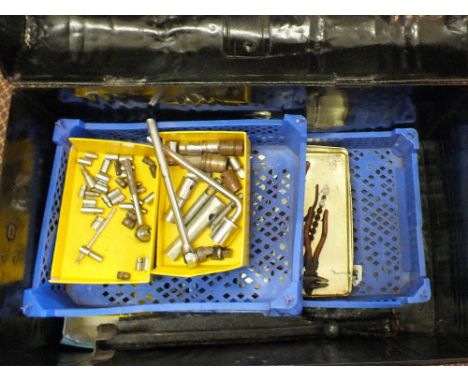 A tin trunk of various motor related tools