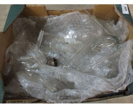 A box of various laboratory glass including a thermometer