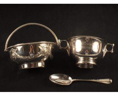 A silver sucrier spoon (with inscription) plus a silver plated swing handled dish