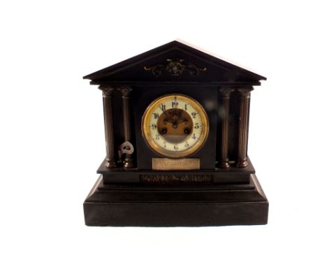 A black marble mantel clock