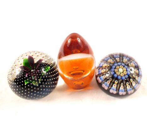 A Caithness flower in the rain paperweight plus two others