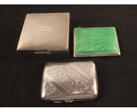 A silver cigarette box plus two cases (one green guilloche enamel, small losses to edge of enamel)