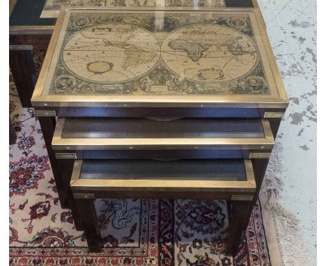 NEST OF TABLES, campaign style mahogany and brass with inset glass and vintage map prints, largest 47cm H x 63cm x 45.5cm. (3