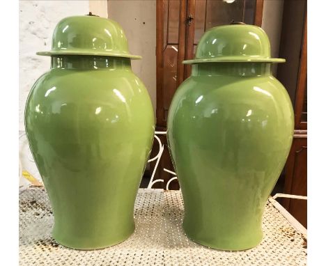 TEMPLE JARS, a pair, Chinese ceramic ginger jar form in leaf green, 53cm H. (2)