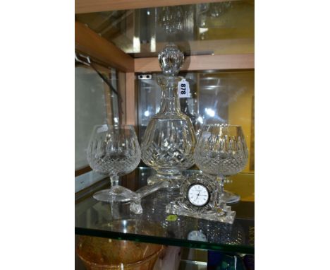 WATERFORD CRYSTAL, comprising a Lismore brandy decanter, two brandy glasses, a quartz clock and butterfly ornament, (Conditio