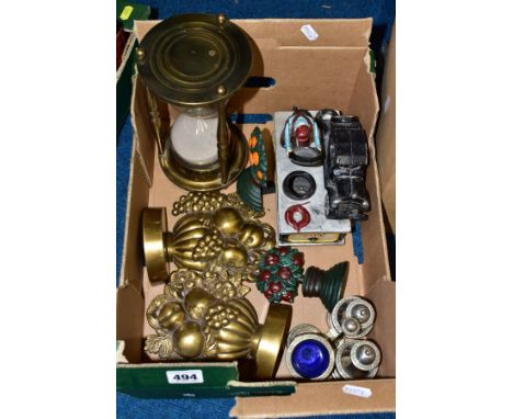 A BOX OF METALWARES, to include a reproduction 'Full Service' cast iron money bank, an oversized brass hour glass, a pair of 