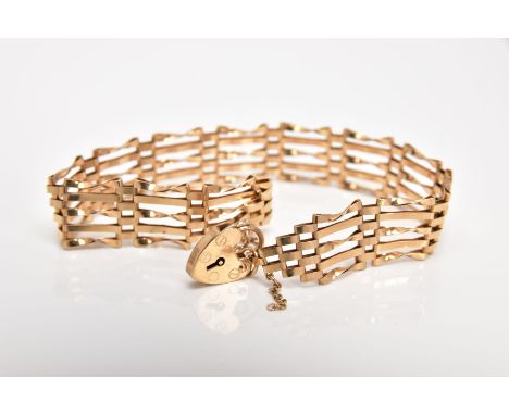 A 9CT GOLD GATE BRACELET, approximate width 6.6mm, fitted with a heart clasp, also fitted with a broken safety chain, hallmar