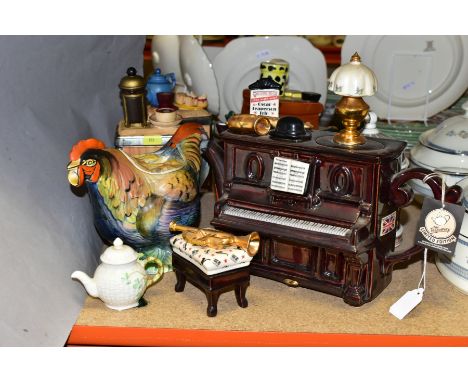 SIX NOVELTY TEAPOTS, ETC, comprising a Belleek miniature, The Tea Pottery Piano and Stool, Tea Pottery Travel- Trunk, Nationa