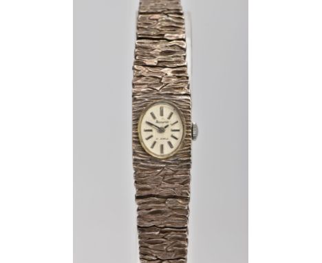 A LADIES SILVER 'ACCURIST' WRISTWATCH, oval silver dial signed 'Accurist 21 jewels', baton markers, hand wound movement, with