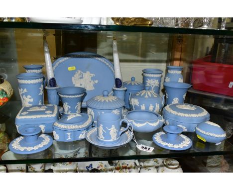 A COLLECTION OF WEDGWOOD PALE BLUE JASPERWARE, including two pairs of dwarf candlesticks, seven assorted boxes and covers, a 