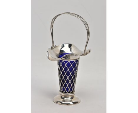 AN EARLY 20TH CENTURY SILVER BUD VASE, of basket design with tapered body, scalloped rim and blue glass liner, silver hallmar