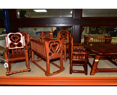 ELEVEN PIECES OF HUNGARIAN WOODEN DOLLS FURNITURE, comprising of two sets, the lighter set comprising rocking chair, rocking 