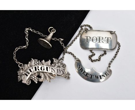 THREE WINE LABELS TO INCLUDE; An early Victorian pierced Burgundy label decorated with fancy foliate and grapes, hallmarked s