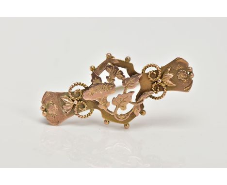 AN EARLY 20TH CENTURY, 9CT GOLD SWEETHEART BROOCH, decorative floral, foliate and rope twist design, applied bead work to par