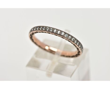 A YELLOW METAL FULL ETERNITY RING, set with colourless stones assessed as cubic zirconia, stamped 'ALE R 52', openwork heart 