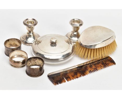 A SELECTION OF SILVER ITEMS, to include two single dwarf candle sticks, each on round weighted bases, one hallmarked rubbed a