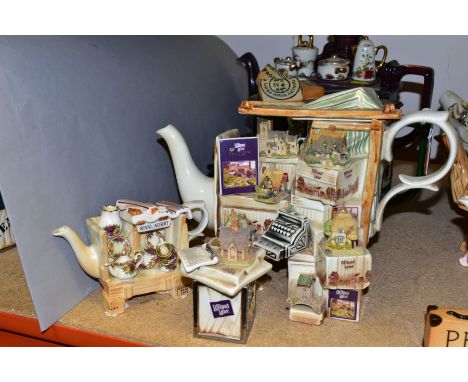 FOUR CARDEW DESIGNS COLLECTORS TEAPOTS AND A NOVELTY SUGAR BOWL, comprising a Lilliput Lane Market Stall teapot and accompany