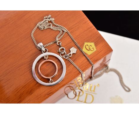 A CLOGAU PENDANT NECKLACE, the pendant of an openwork circular design, fitted with a tapered bail signed 'Clogau', suspended 
