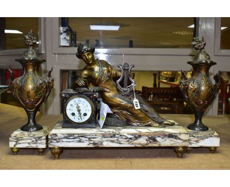 A LATE 19TH CENTURY FRENCH BRONZED SPELTER AND MARBLE FIGURAL CLOCK GARNITURE, the clock with reclining female musician in cl