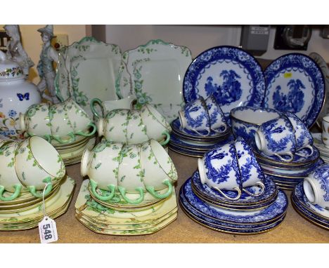 A PARAGON 'CONVULVULOUS' PATTERN PRINTED AND TINTED TEA SET AND A ROYAL DOULTON BLUE AND WHITE TRANSFER PRINTED TEA SET, the 