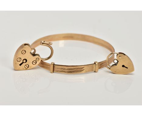 A 9CT GOLD CHILDS BANGLE AND TWO HEART SHAPED CLASPS, the child's bangle with a textured design, hallmarked 9ct gold London, 