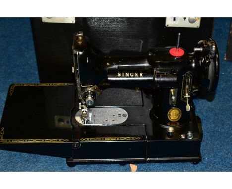 THREE CASED ELECTRIC SEWING MACHINES IN CARRY CASES, comprising a Singer 222K, serial no EK325799, another Singer, model 514 
