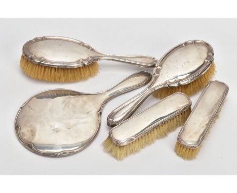 FIVE PIECES OF SILVER VANITY ITEMS, to include two hair brushes, each of a plain polished design with a wavy rim, hallmarked 